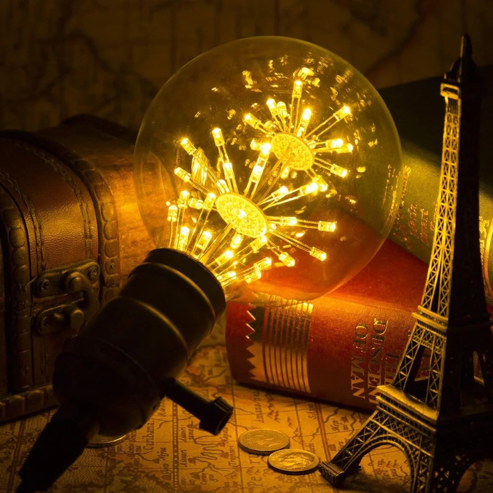 Ampoule vintage feu d'artifice allumé et mini tour Eiffel 