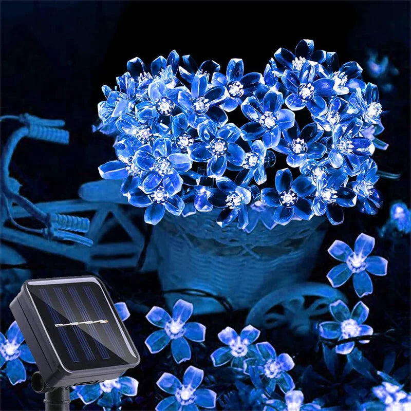 Guirlande lumineuse extérieur LED fleurs de cerisier dans une corbeille 