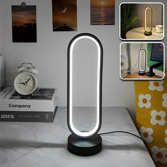 Lampe led de table ovale dans une chambre à côté d'un réveil 