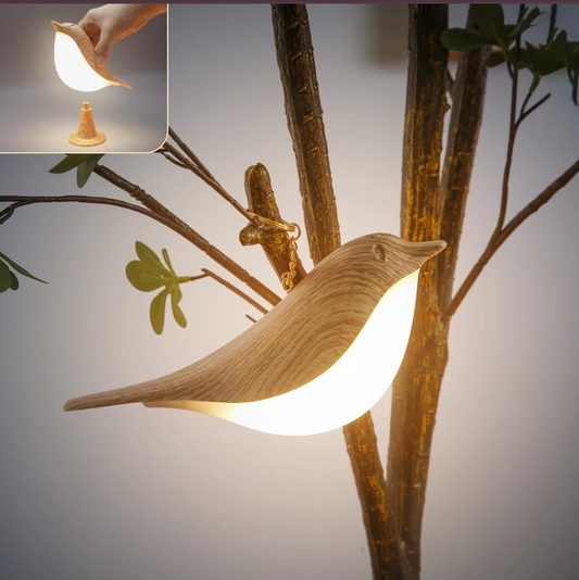 Lampe de chevet en forme d’oiseau accroché sur une plante 