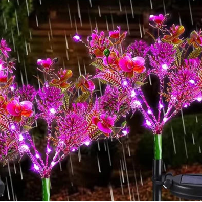 Lampe solaire extérieur en forme d'orchidée sous la pluie 