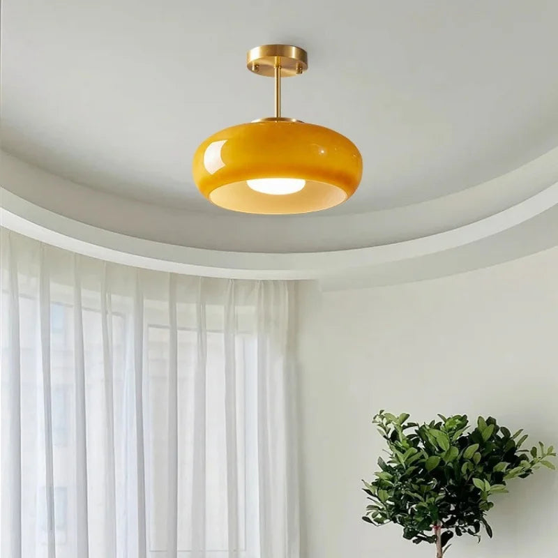 Suspension orange avec bras doré 