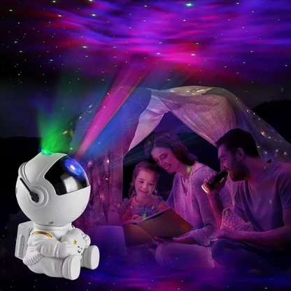 Un père qui lit un livre avec veilleuse projecteur astronaute  