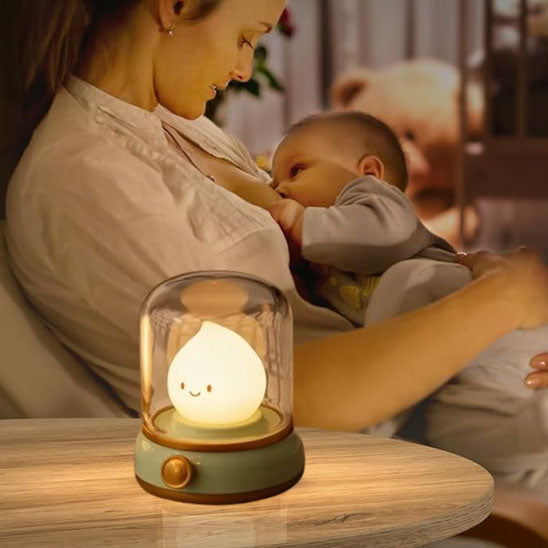 Veilleuse flamme et maman qui allaite 