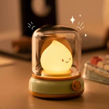 Veilleuse flamme pour bébé sur table de chevet 