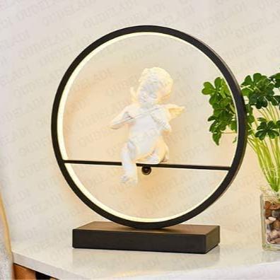 Lampe de chevet LED Angel noir sur table blanche 
